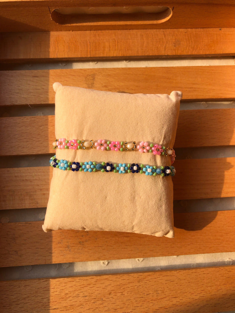 Handmade colorful daisy seed bead bracelet set of 2 in pink green and blue navy on cream cushion