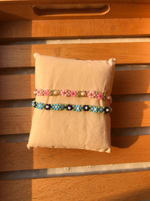 Handmade colorful daisy seed bead bracelet set of 2 in pink green and blue navy on cream cushion