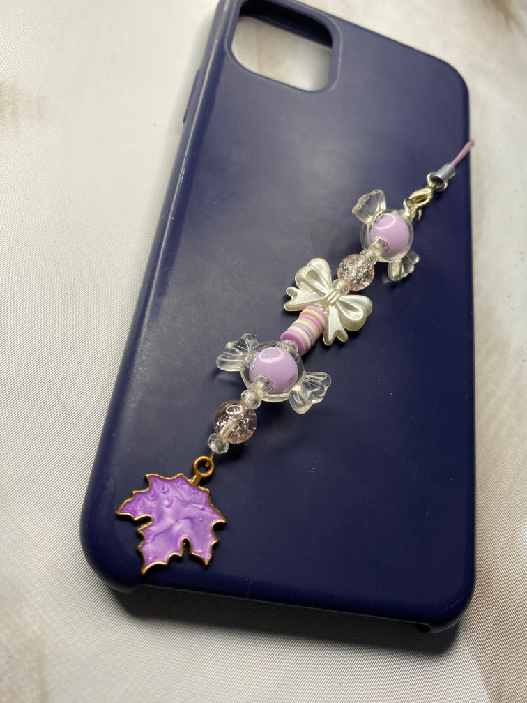 Handmade kawaii bow phone charm with maple leaf on navy case